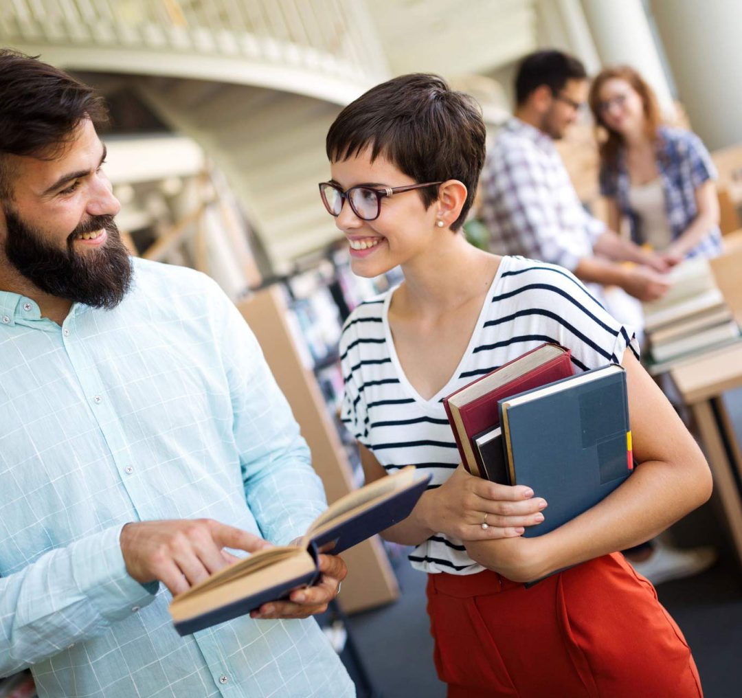 group-of-college-students-studying-at-library-SC9PWKV.jpg