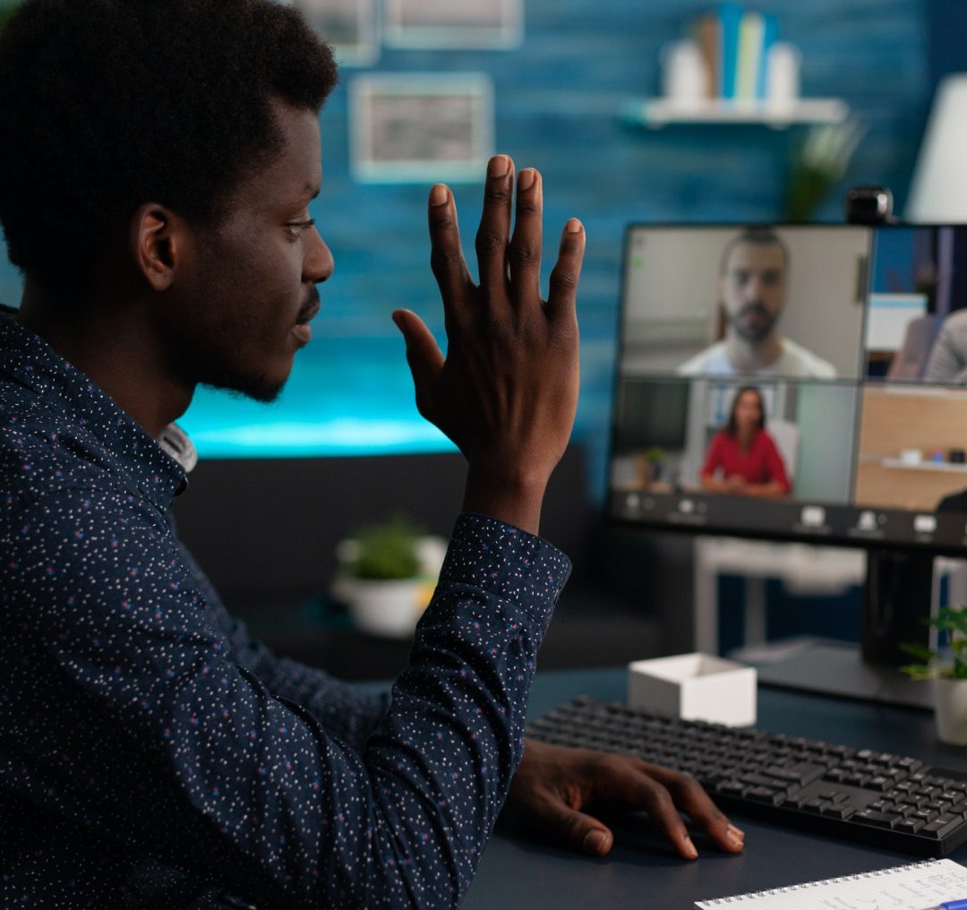 Student greeting remote school business team on videocall